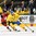 GRAND FORKS, NORTH DAKOTA - APRIL 18: Sweden 's Jakob Cederholm #3 skates with the puck while fending off Switzerland's Nico Hischier #13 during preliminary round action at the 2016 IIHF Ice Hockey U18 World Championship. (Photo by Minas Panagiotakis/HHOF-IIHF Images)

